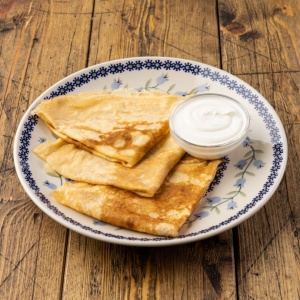 Blini with with sour cream
